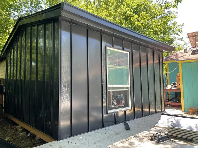 Black standing seam metal wall panels for Roof Inspection in Pitman