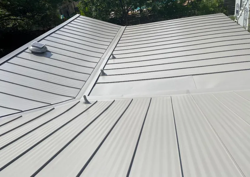 Solar attic fan installed on a metal roof for Roof Ventilation in Pitman
